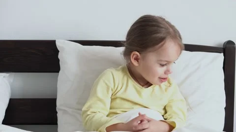 Close up Authentic cute little sick preschool child girl measures temperature Stock Footage 152539139