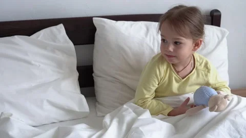 Close up Authentic cute little sick preschool child girl with teddy bear in his Stock Footage 152953542