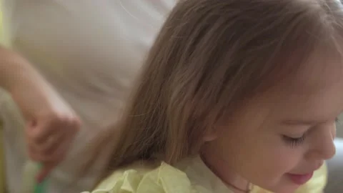 Close up authentic cute young caucasian woman mom caring for child braids Stock Footage 150282493