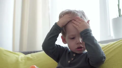 Close up authentic sick little preschool excited child boy 2-3 years in touches Stock Footage 149358657