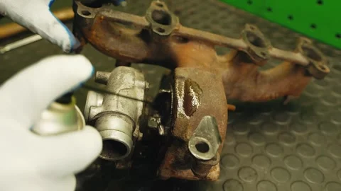 Close up auto mechanic hands in gloves sprays cleaner degreazer on a rusty car Stock Footage 281581760