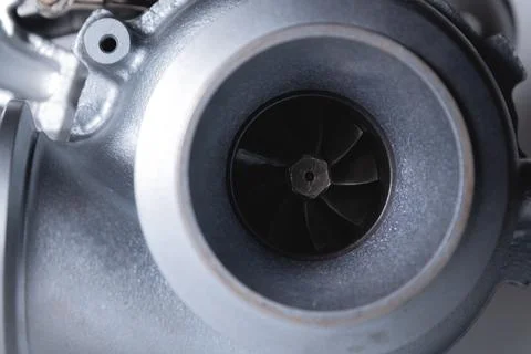 Close-up of an auto part for an internal combustion engine. Gas turbine. Turbo Stock Photos