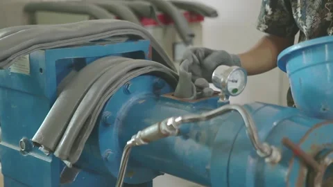 Close-up of Automated Extrusion Machine Processing Synthetic Rubber Material Stock Footage 336712961