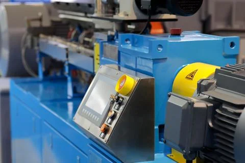 Close up of automated plastic extruder machine Stock Photos