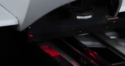 Close up of automated visual optical inspection system with red illumination for Stock Footage 201211179