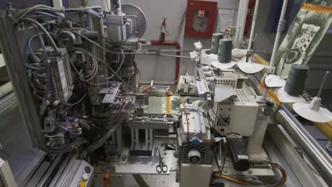 Close up at the automatic attachment loom at the fabric and garment factory Stock Footage 150701755