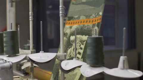 Close up at the automatic attachment loom at the fabric and garment factory Stock Footage 150702312