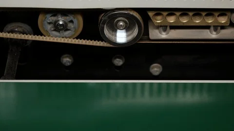 Close-up automatic bag sealing machine. Sealing packages with coffee. Stock Footage 115785877