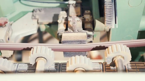 Close-up of automatic belt sander, modular bead sticking machine. Action Stock Footage 120265314