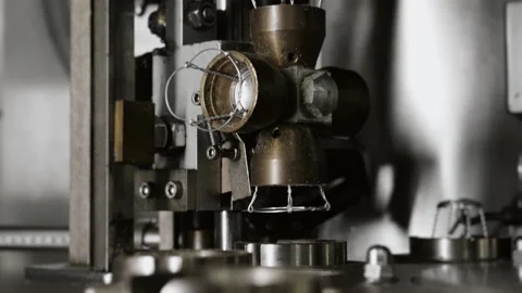 Close-up of the automatic cork insertion process on champagne bottles. Stock Footage 288549659