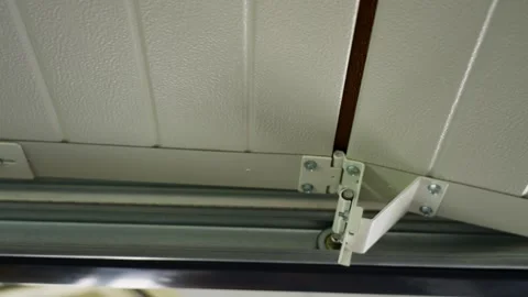 Close-up of automatic garage door lifting. Stock Footage 315770877