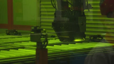Close-up of automatic machinery moving along the steel structure and welding the Stock Footage 202049549