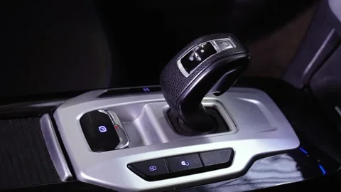 Close up of on automatic modern gear shift knob. The silver black gearshift of a 스톡 동영상 148233177
