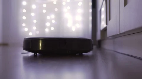Close-up automatic robot vacuum cleaner Stock Footage 121314348