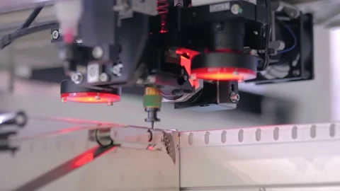 Close up: automatic SMD pick and place machine assembling computer circuit board Stock Footage 145154084
