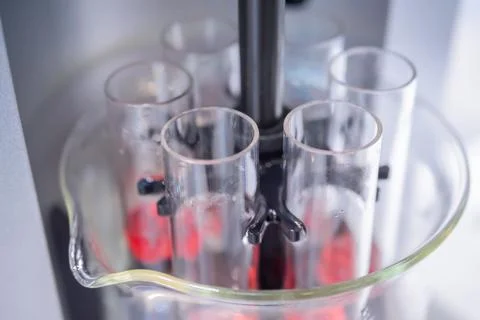 Close up: automatic tablet disintegration tester - laboratory equipment concept Stock Photos