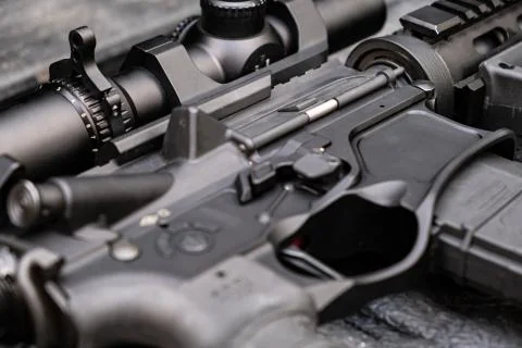 Close up automatic weapon black lying a table Concept of war and private Stock Photos