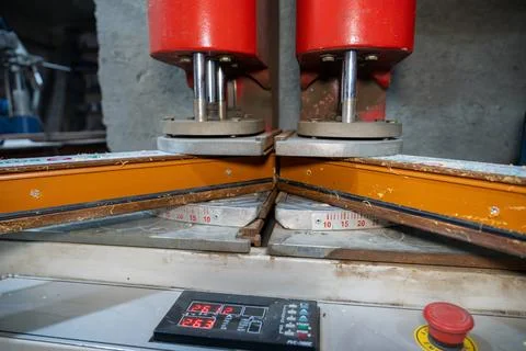 Close up of automatic welding machine for plastic window frames. Stock Photos