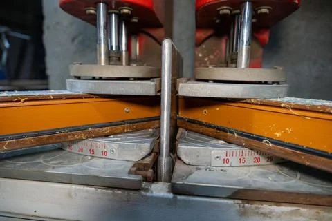 Close up of automatic welding machine for plastic window frames. Stock Photos