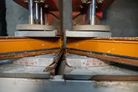 Close up of automatic welding machine for plastic window frames. Stock Photos