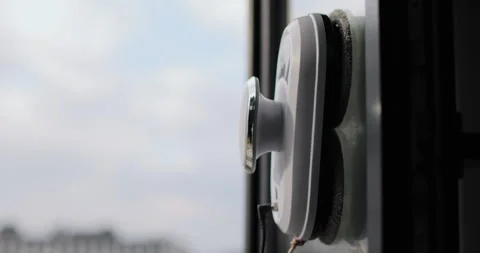 Close up automatic window cleaning robot operating on residential window Stock Footage 320070405