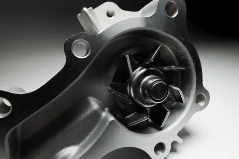 Close-up of an automobile engine liquid cooling pump. new part on gray gradient Stock Photos