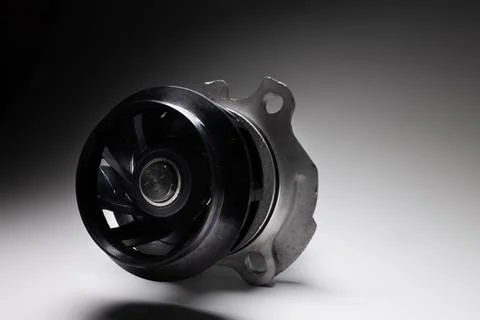 Close-up of an automobile engine liquid cooling pump. new part on gray gradient Stock Photos