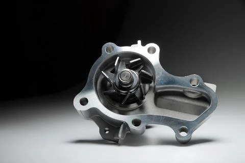 Close-up of an automobile engine liquid cooling pump. new part on gray gradient Stock Photos