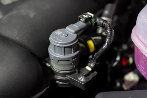 Close up of automotive sensor in engine compartment Stock Photos