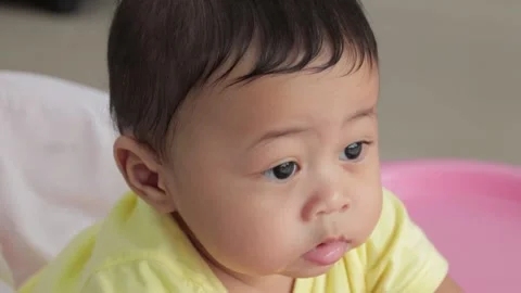Close-up of baby boy with blur background Stock Footage 224431560