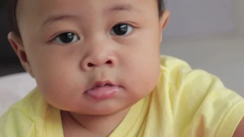 Close-up of baby boy with blur background Stock Footage 224431594