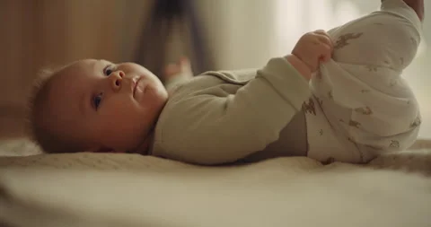 Close-up of Baby Boy Doing Tummy Time Exercises Stock Footage 318687310