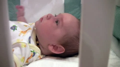 Close up of baby in cradle Stock Footage 10912848