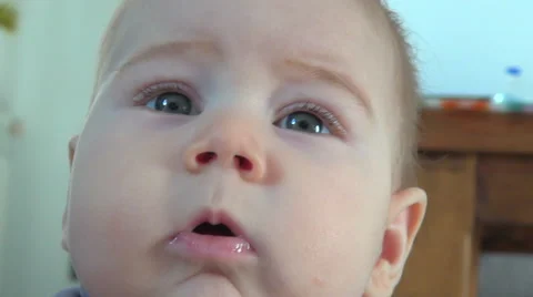Close-up baby face looking at camera Stock Footage 44123575
