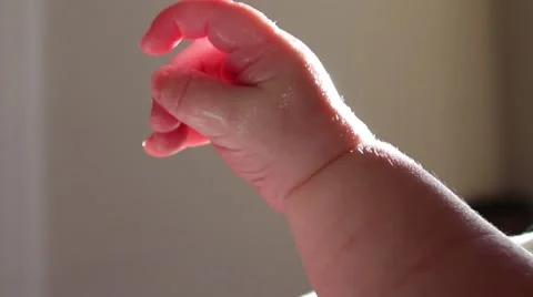 Close up of baby's hand Vídeos de archivo 58883303