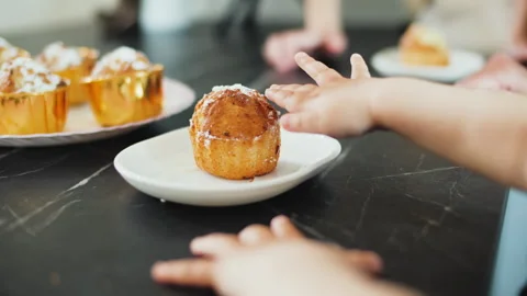 Close-up of a baby's hand touching cupcake 库存影片 241922488
