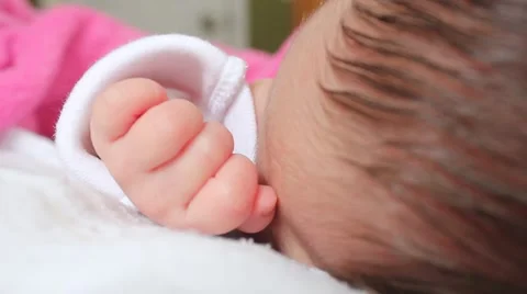 Close-up of a baby's hand while she sleeps Stock Footage 54318532
