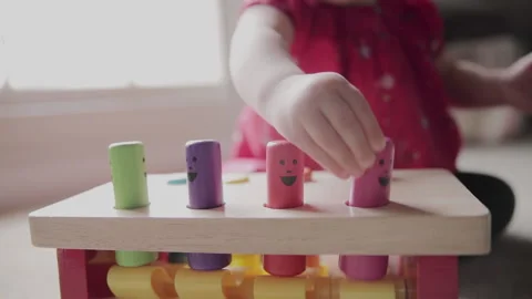 Close up of baby's hands, playing with colorful, educational toy in slow motion 動画素材 130467366