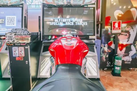 Close up on the back and nitrous oxide button of an arcade motorbike Stock Photos