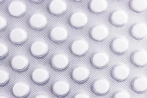Close up of back of foil packet white pills Stock Photos