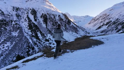 Close-Up Back-Follow Drone Shot Walking Up a Ridge With Valley View Stock-Footage 323903241