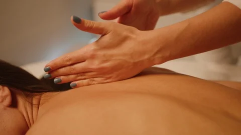 Close up of back massage session Stockbeeldmateriaal 126350610