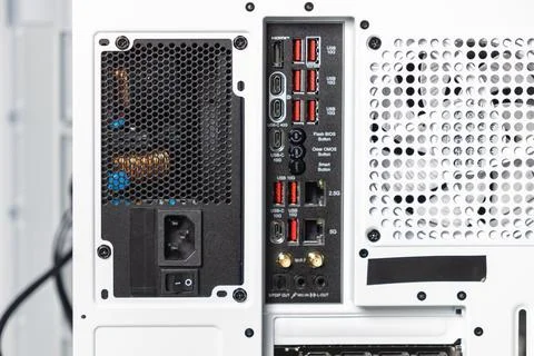 Close-up of back panel of white computer case showing power supply, motherb.. Stock Photos