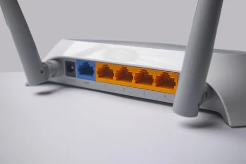 Close-up of the back panel of a white wireless router, showing the power in.. Stock Photos