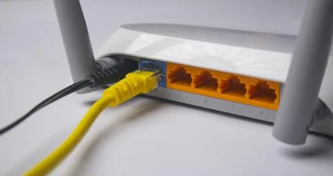 Close-up of the back panel of a white wireless router, featuring a black po.. Stock Photos