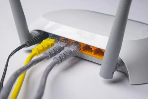Close-up of the back panel of a white wireless router, featuring a black po.. Stock Photos