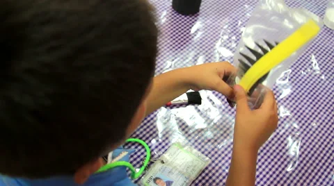 CLOSE UP-BACK SHOULDER. Boy doing activities in the kindergarten. Stock-Footage 48426228
