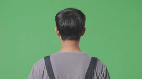 Close Up Of Back View Asian Man Worker Walking In The Green Screen Background Stock Footage 253467137