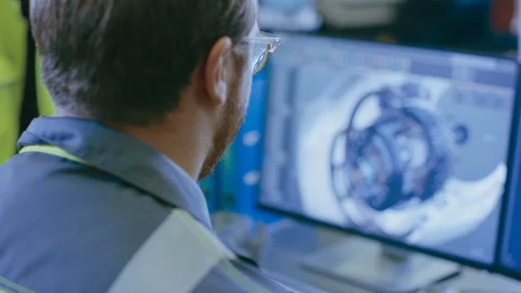Close-up Back View of the Mechanical Engineer Designing 3D Engine Model on PC Stock Footage 93686946