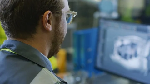 Close-up Back View of the Mechanical Engineer Designing 3D Engine Model on PC Stock Footage 93687031